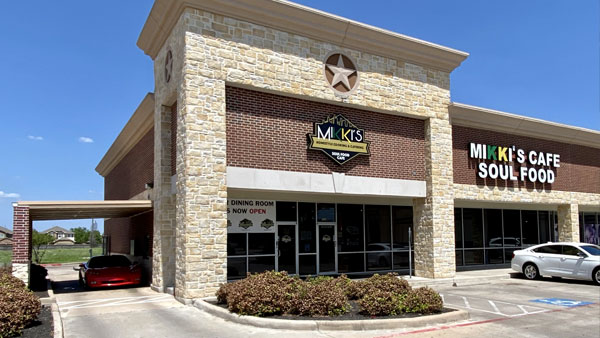 Exterior view of our new 2nd location in Pearland, showcasing the modern architecture and prominent signage.