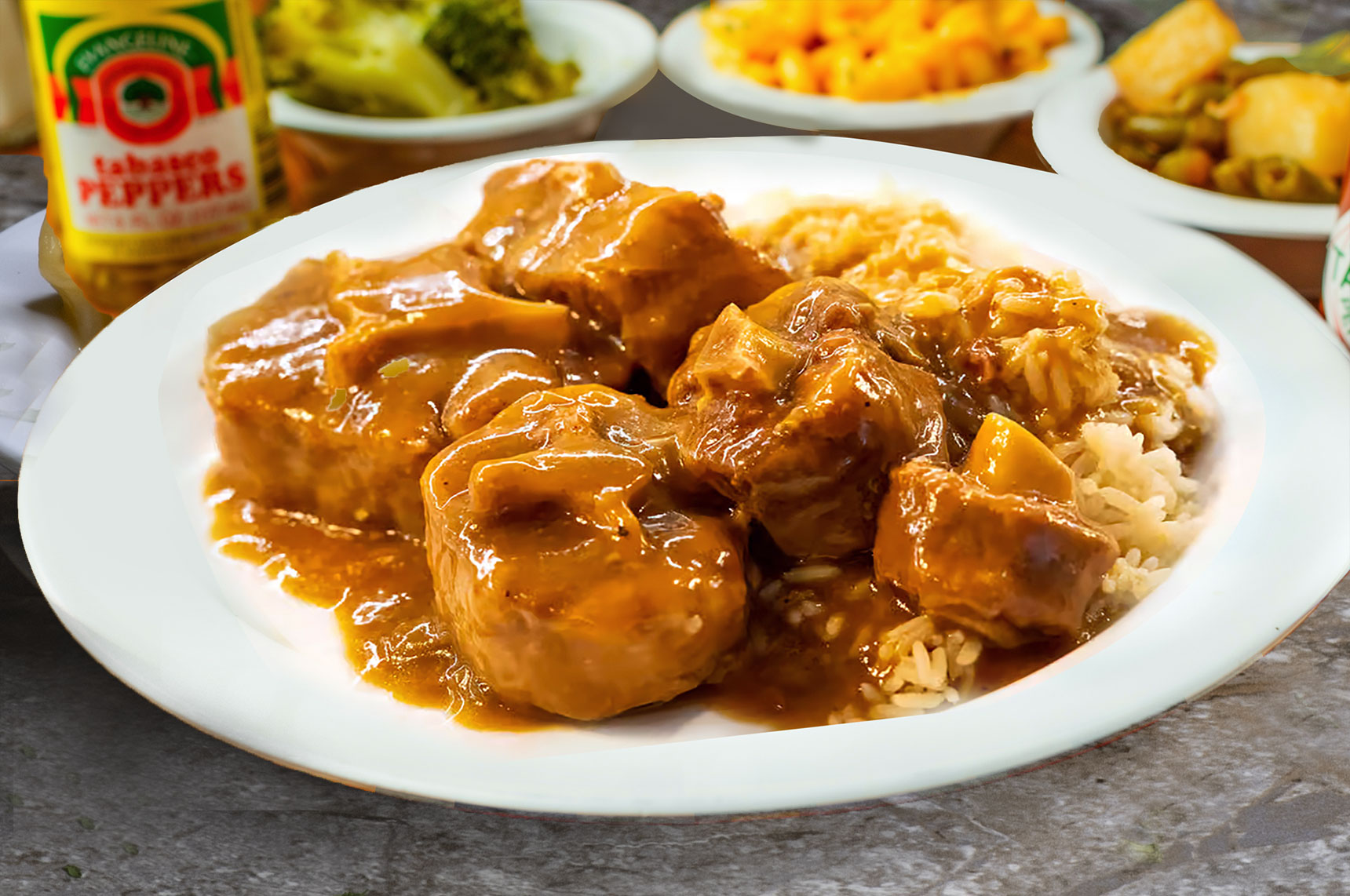 A plate of authentic soul food tender and flavorful Ox Tails, braised in a rich, savory gravy.