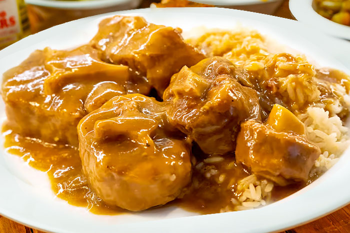A plate of tender and flavorful Ox Tails, braised in a rich, savory gravy.